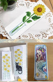 Illustrative finished cross-stitch bookmark designs; completed embroidery and patterns are not included